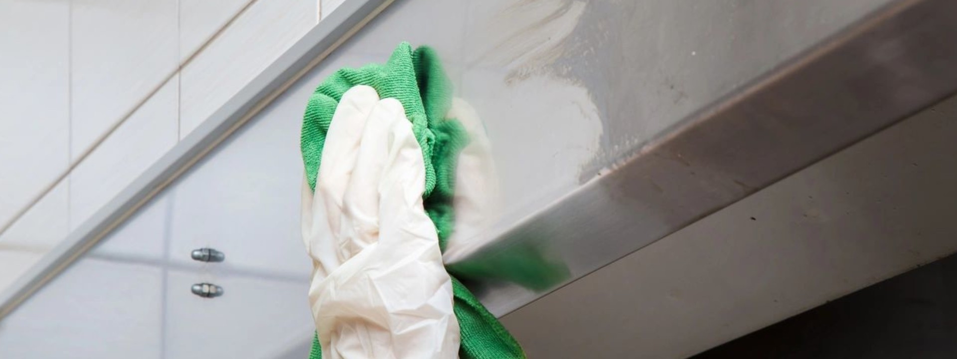 A green and white cloth is hanging on the wall